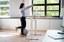Worker Stretch Exercise At Stand Desk